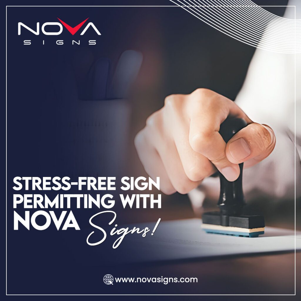 A hand stamping a document, representing stress-free sign permitting services by Nova Signs.